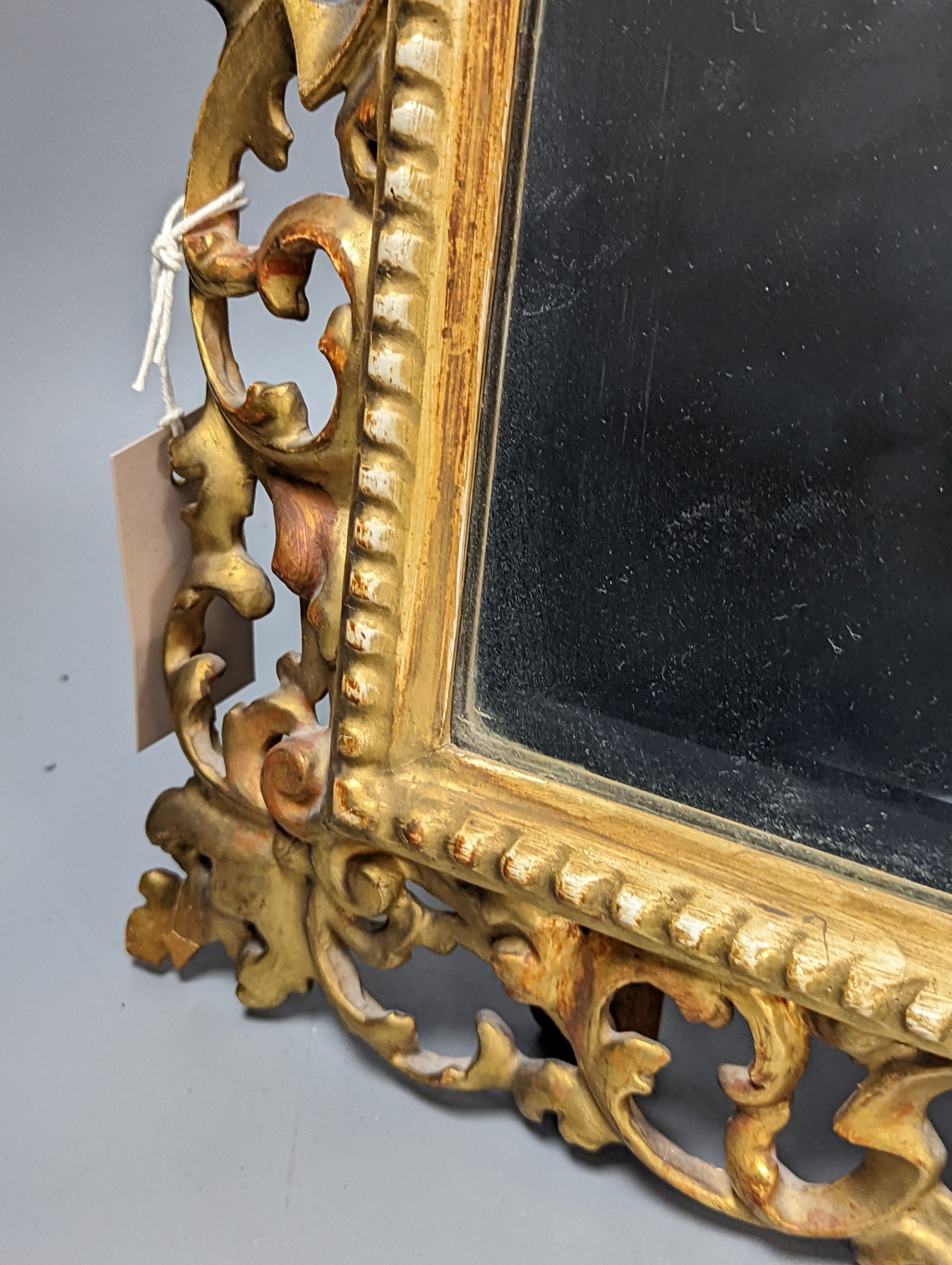 A Florentine giltwood framed mirror, with later easel back, 54 cms high x 43 cms wide.